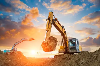 Excavators working at sunrise, showcasing the expertise of Earthworks Hawkes Bay on the About Us page.
