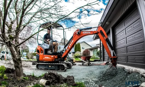 A compact excavator in action, clearing gravel and soil for a small excavations project by Earthworks Hawkes Bay. A compact excavator in action, clearing gravel and soil for a small excavations project by Earthworks Hawkes Bay.